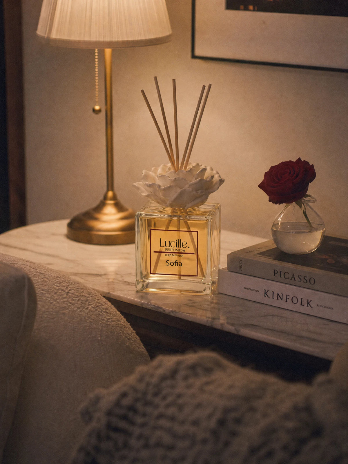 Sofia 500 ml beside books and a lamp, styled with an optional gypsum flower accessory